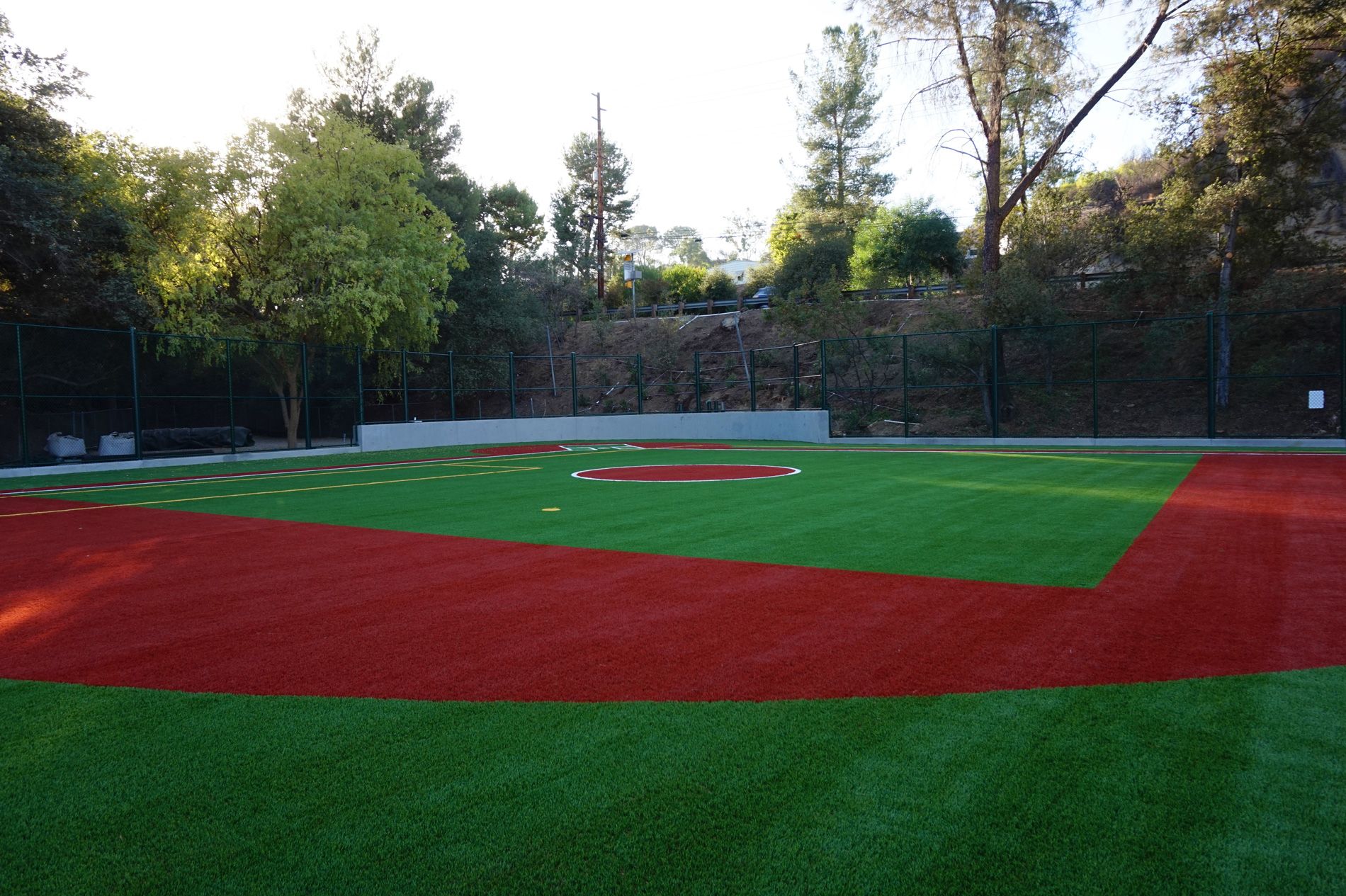 Completed baseball diamond with red and green synthetic turf at Robertson Family Field, Viewpoint School in Calabasas