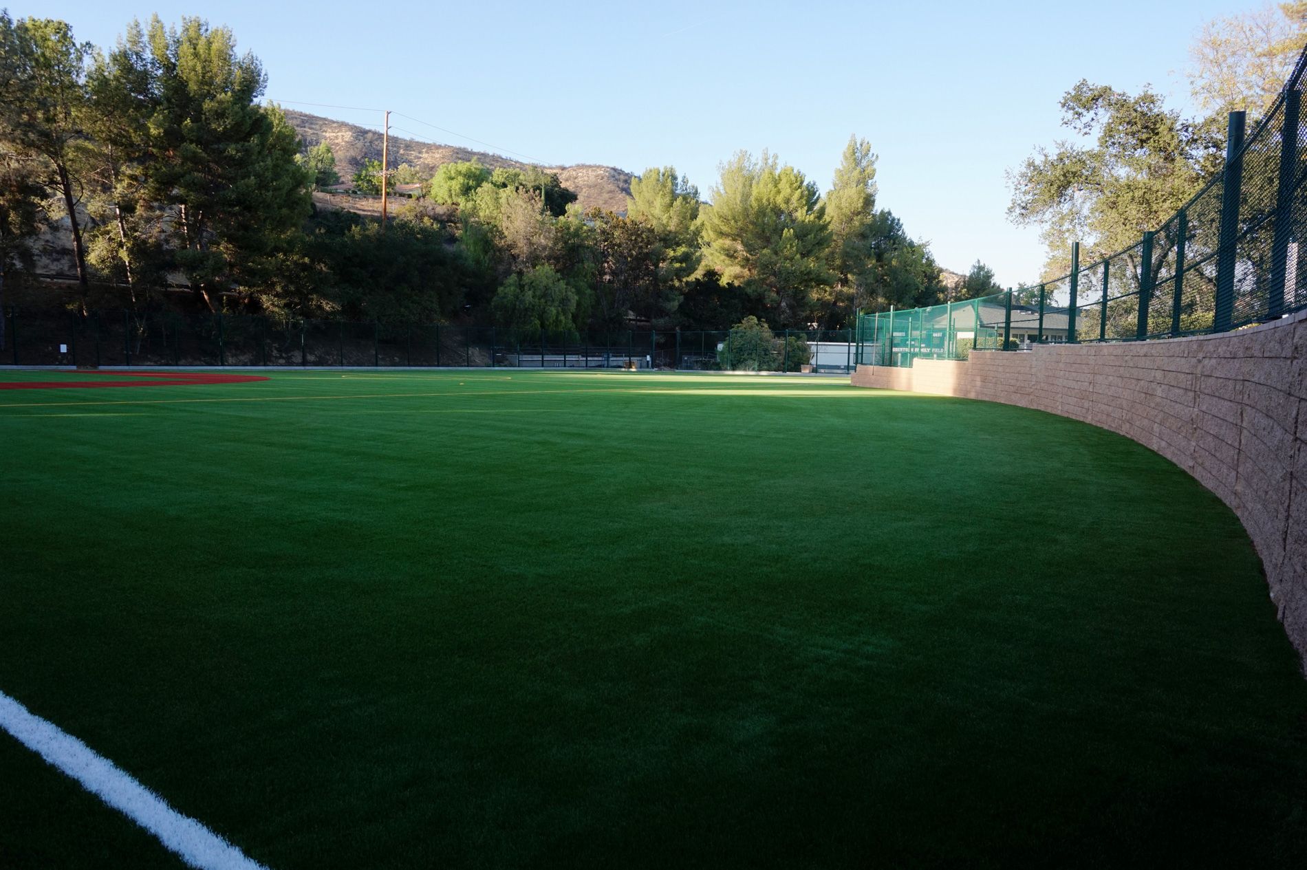 Green synthetic outfield turf and boundary netting at Robertson Family Field, Viewpoint School