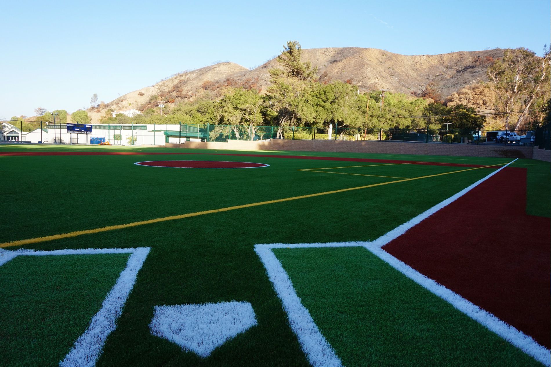 Home plate and infield with red warning-track turf at Robertson Family Field, Viewpoint School