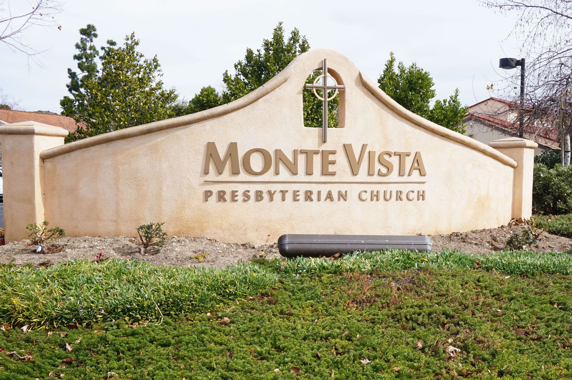 Monument sign for Monte Vista Presbyterian Church, cast and finished in stucco with a cross finial