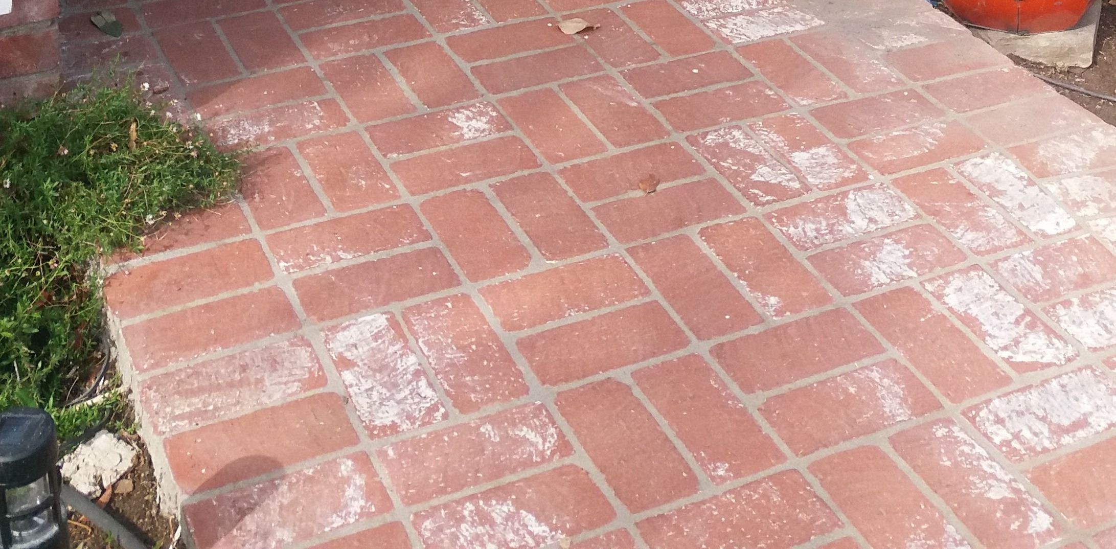 Close-up of red clay brick paving laid in a tight running bond